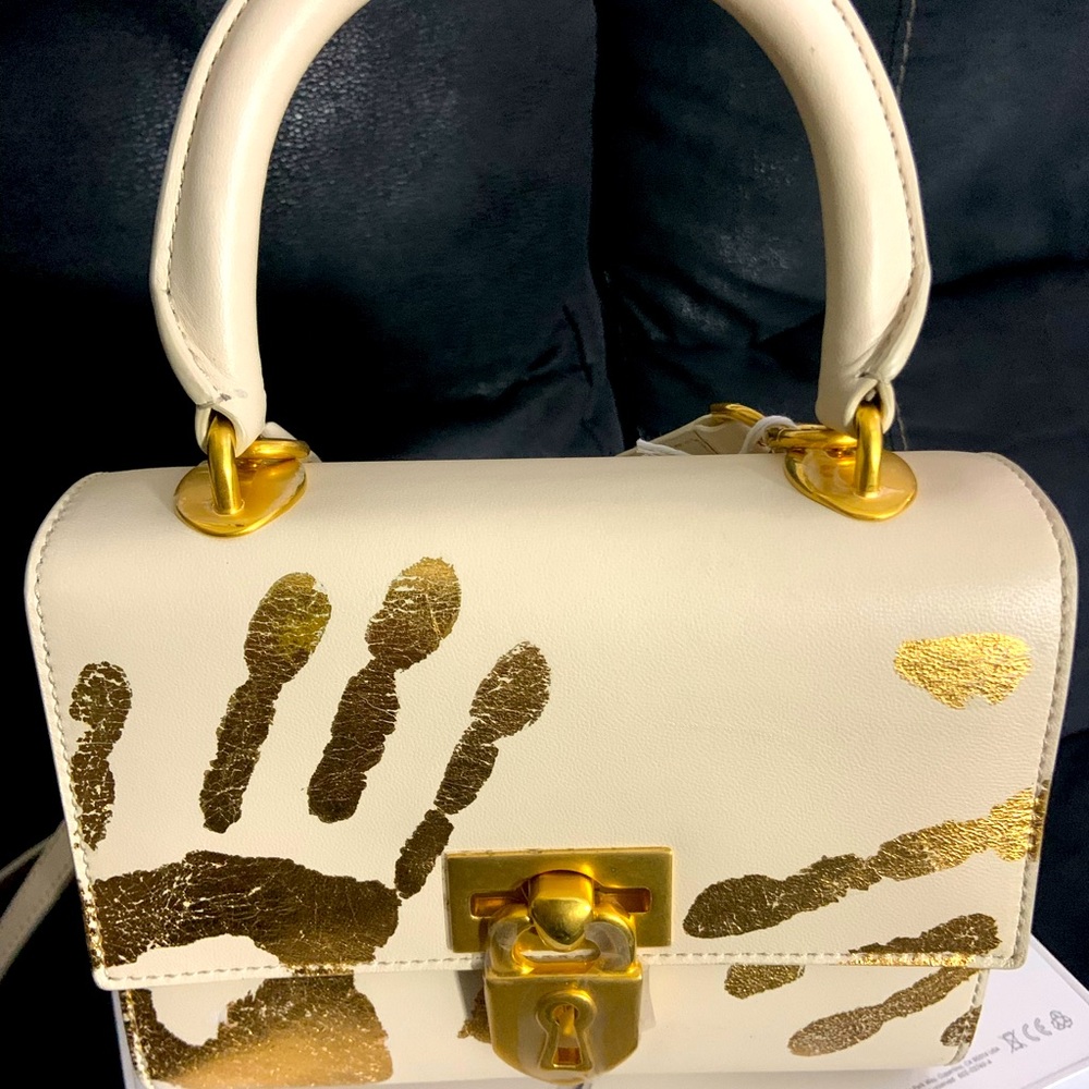 .schiaparelli.com handprint secret bag